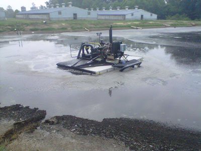 ASI Sludge Buster agitation boat on a lagoon